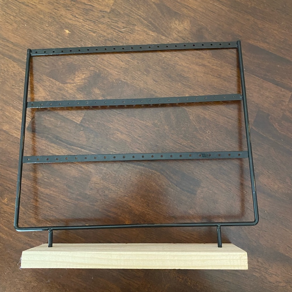 Metal earring holder with a wood base